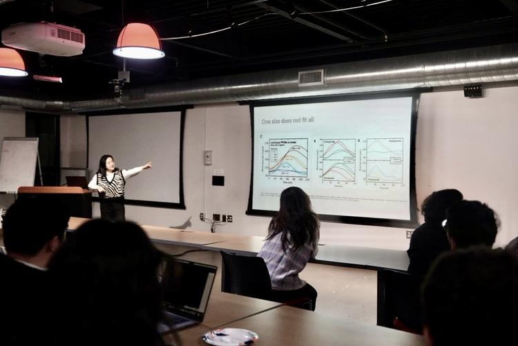 a DTI member presenting a series of graphs at the Half-Baked event